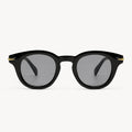 Lunettes de soleil Niko Midnight noires Osour Eyewear avec monture ronde noire, détails dorés et verres noirs