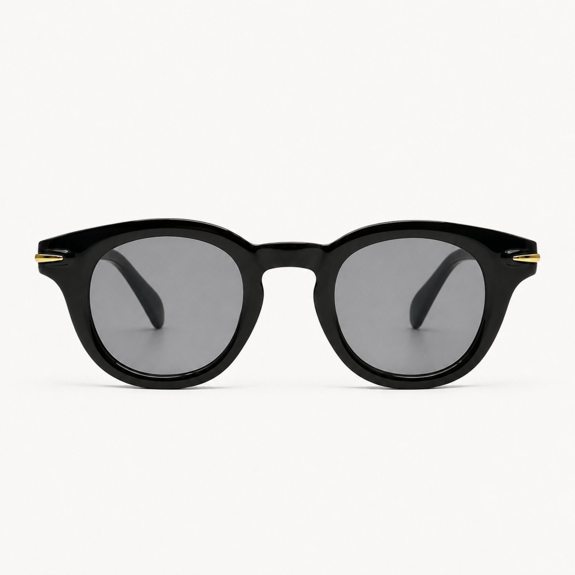Lunettes de soleil Niko Midnight noires Osour Eyewear avec monture ronde noire, détails dorés et verres noirs