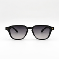 lunettes de soleil noires face Osour La Véra